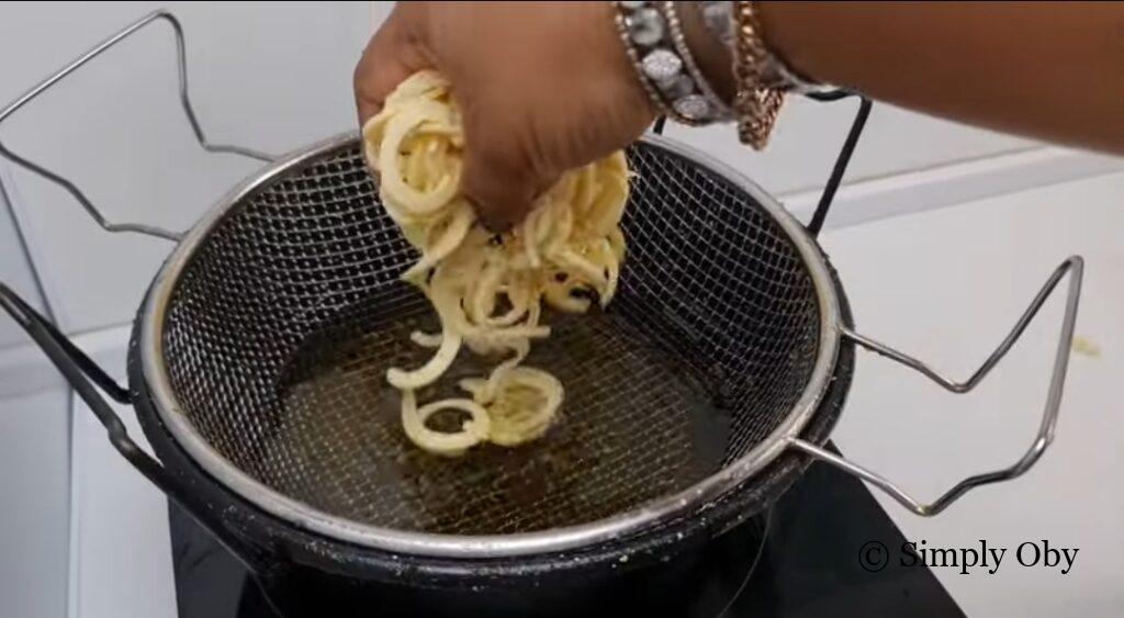 Frying homemade plantain chips