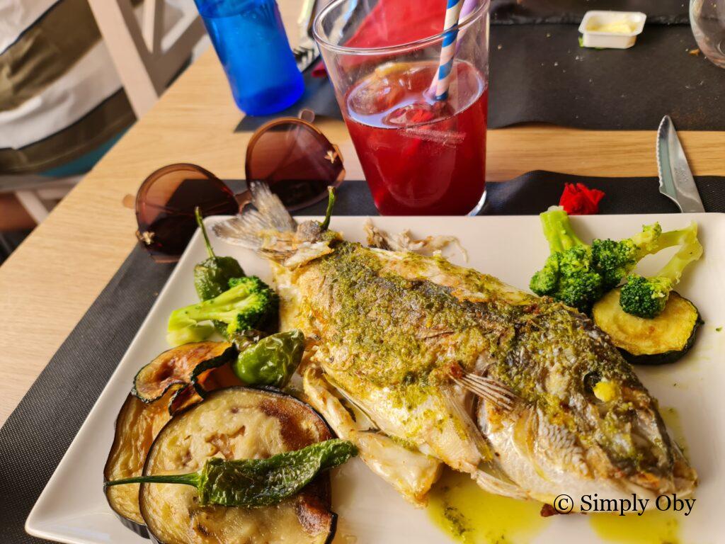 Plate of grilled fish and veggies