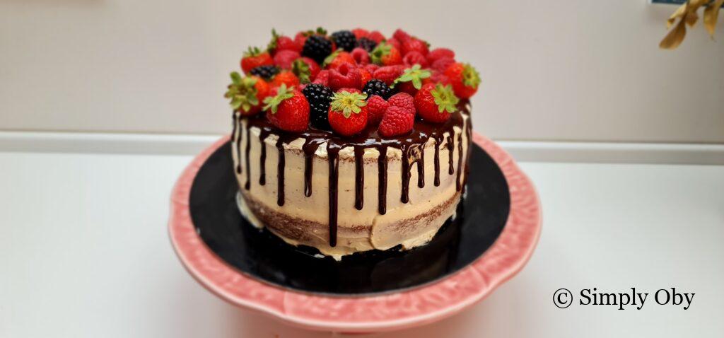 Cake decroated with red berries