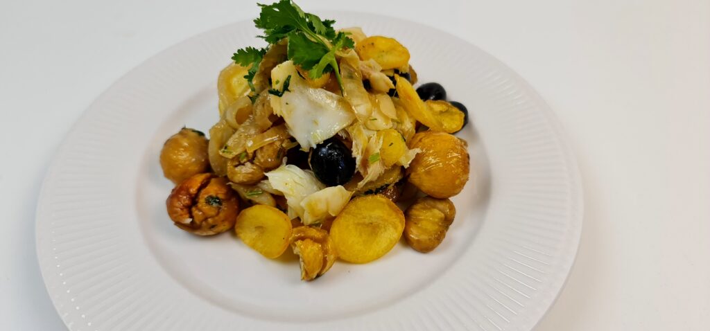 Plate of bacalhau with chestnuts and potatoes