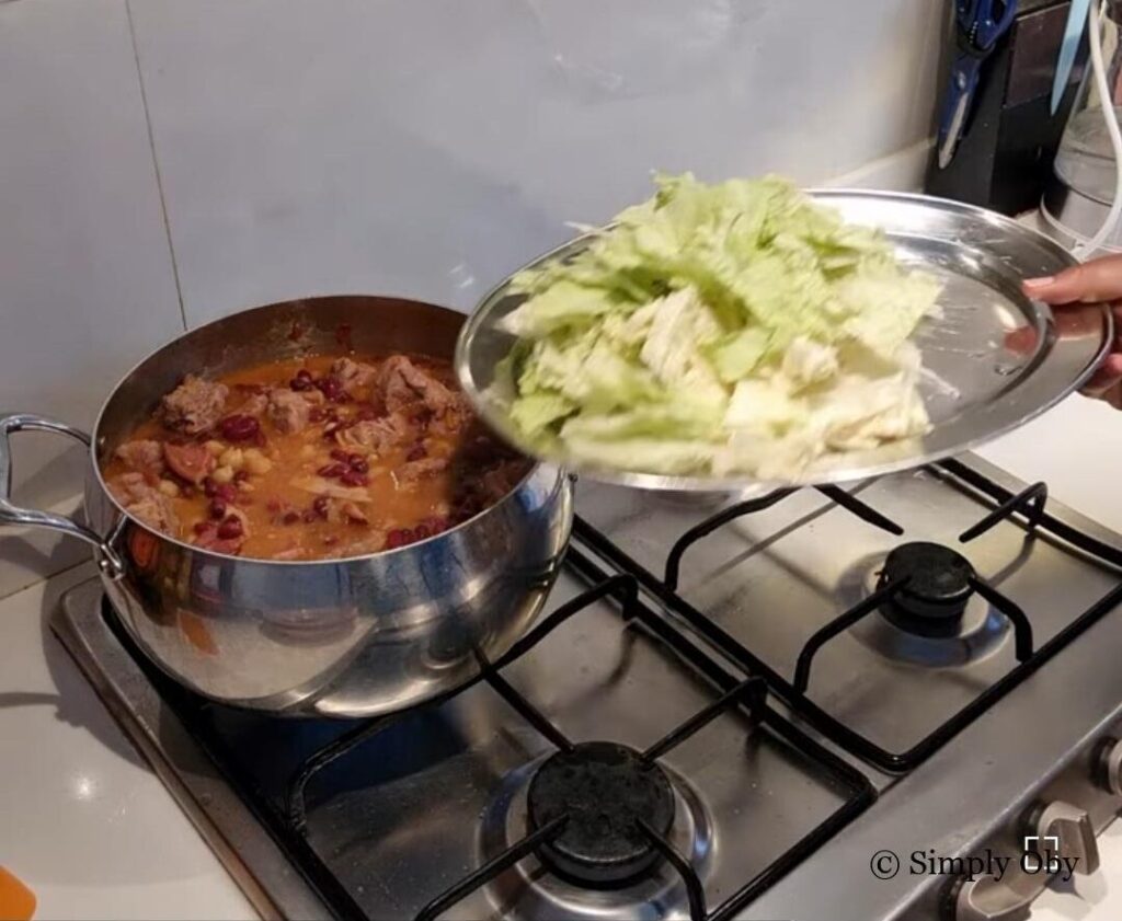 Adding cabbage to a pot