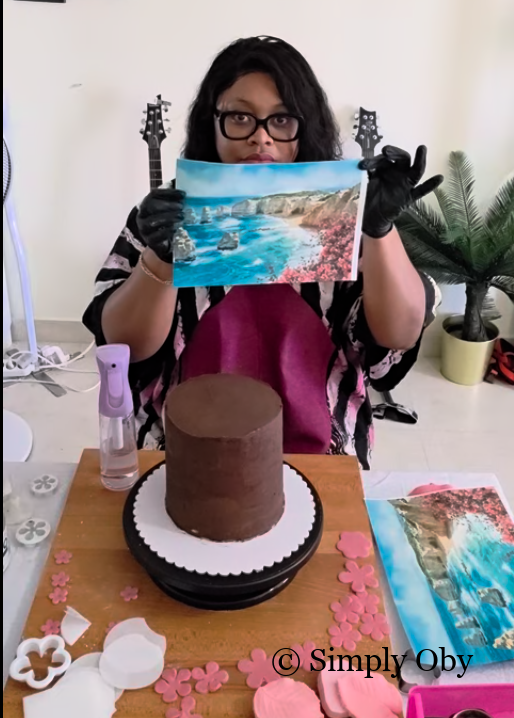 Simply Oby decorating a cake